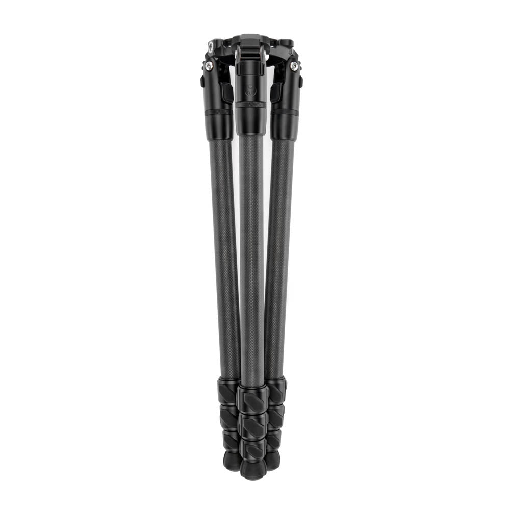 A black carbon fiber tripod shown folded vertically against a solid white background.
