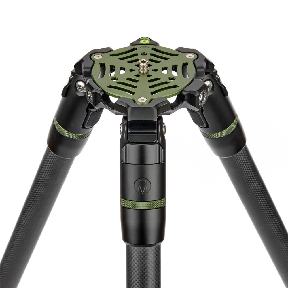 Close-up of a tripod head and lower legs in black and olive green, shown on a plain white background.