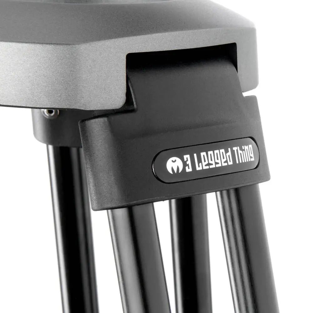 Close-up of a tripod with '3 Legged Thing' branding on a white background