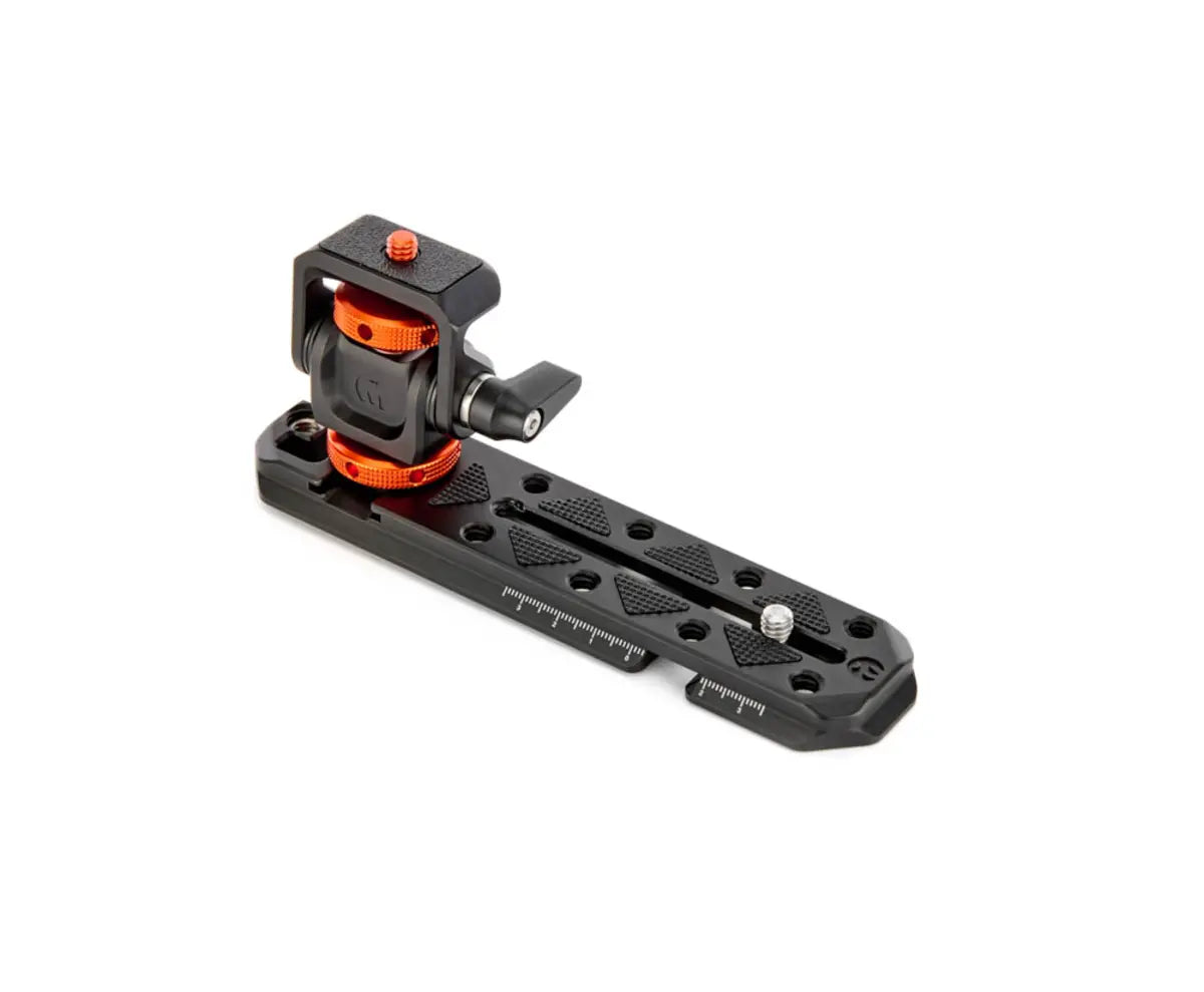Camera accessory with black and orange design on a white background