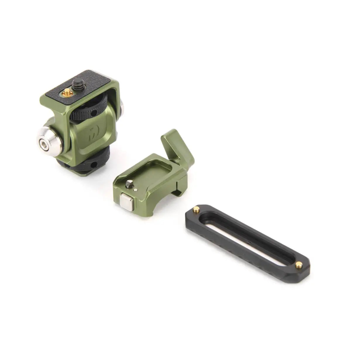 Three green metal components on a white background