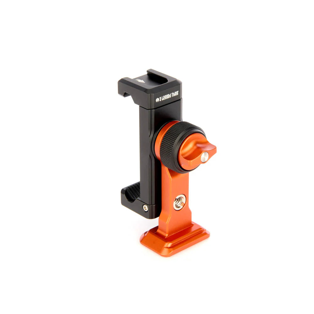 An orange and black phone mount holding, shown from a side angle against a clean white background.