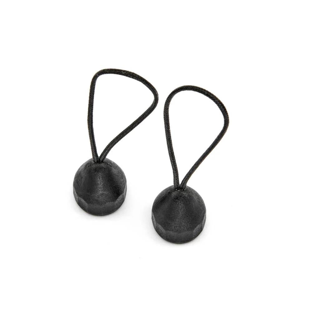 Two black quick detach lug adaptors on a white background