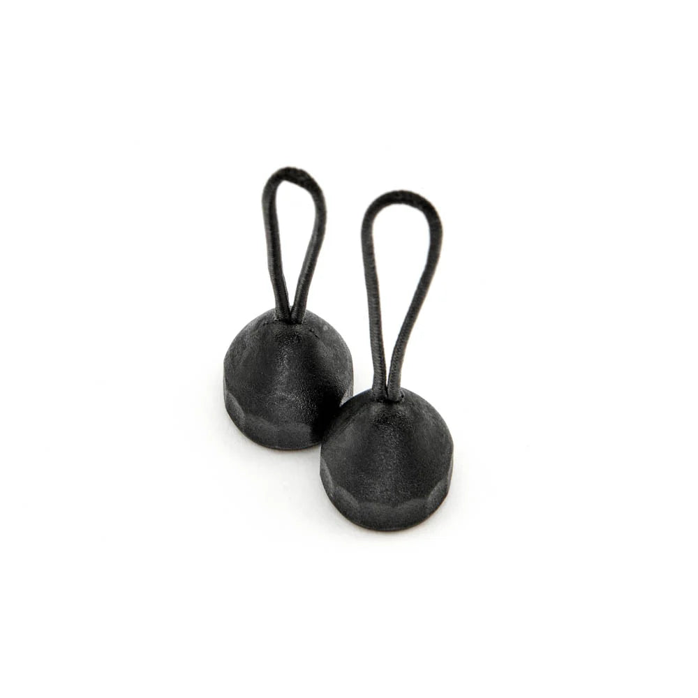 Two black quick detach lug adaptors on a white background