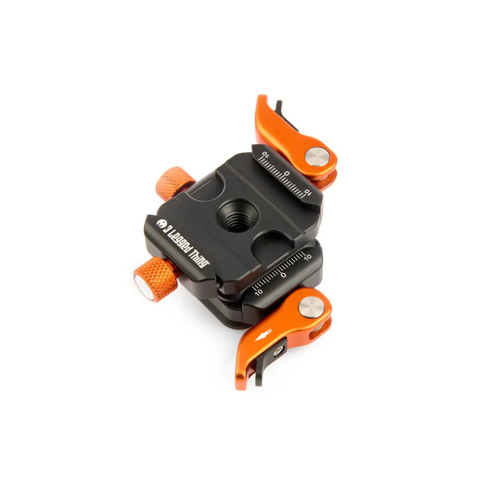Camera lens support with orange and black design on a white background
