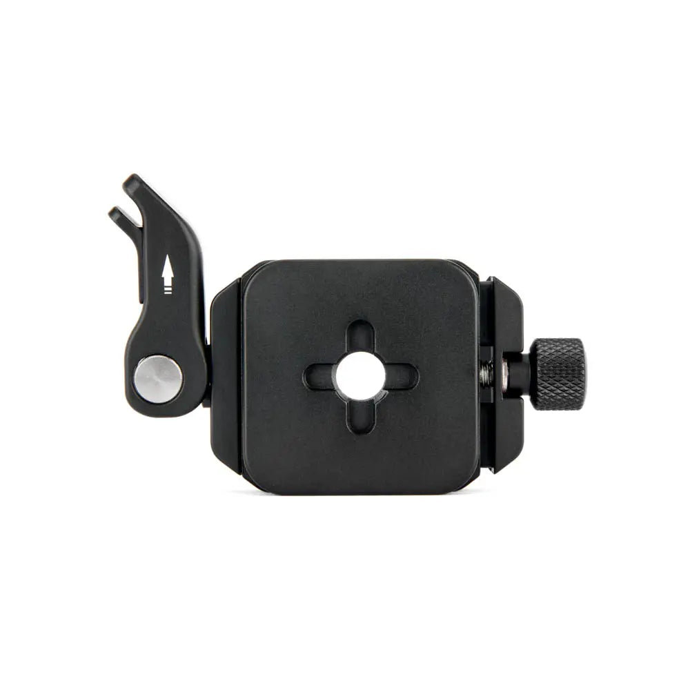 Black camera accessory with a central hole and lever on a white background