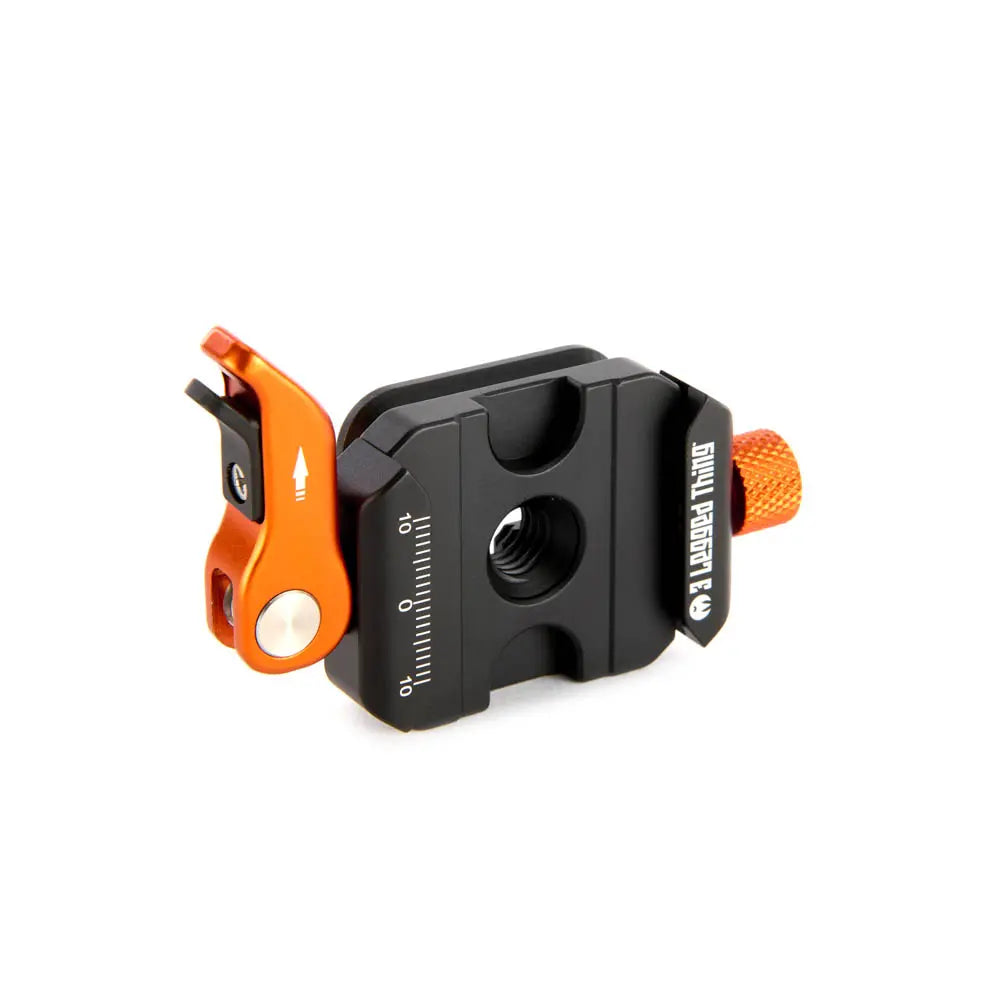 Black and orange mechanical device on a white background