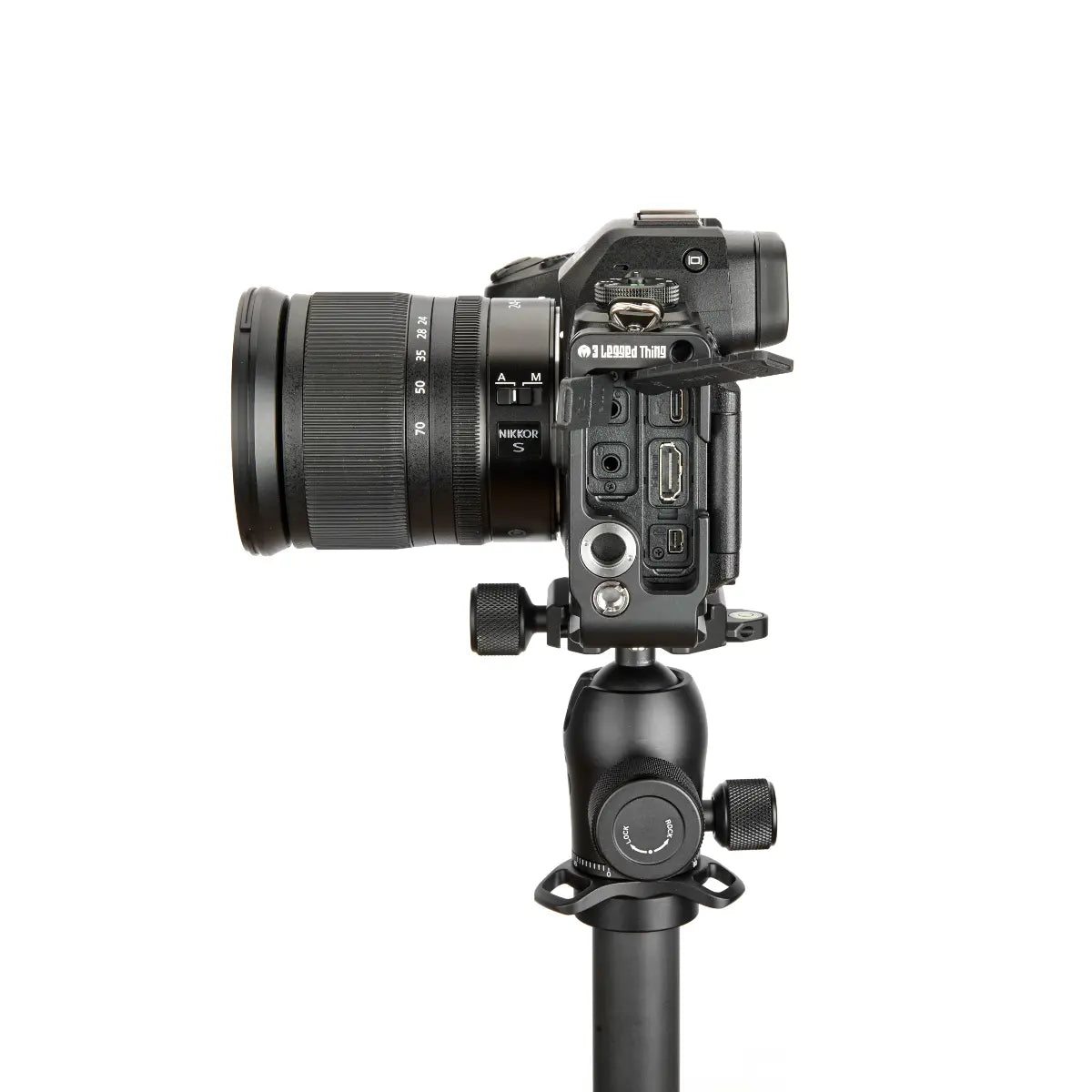 Camera on a tripod with a white background