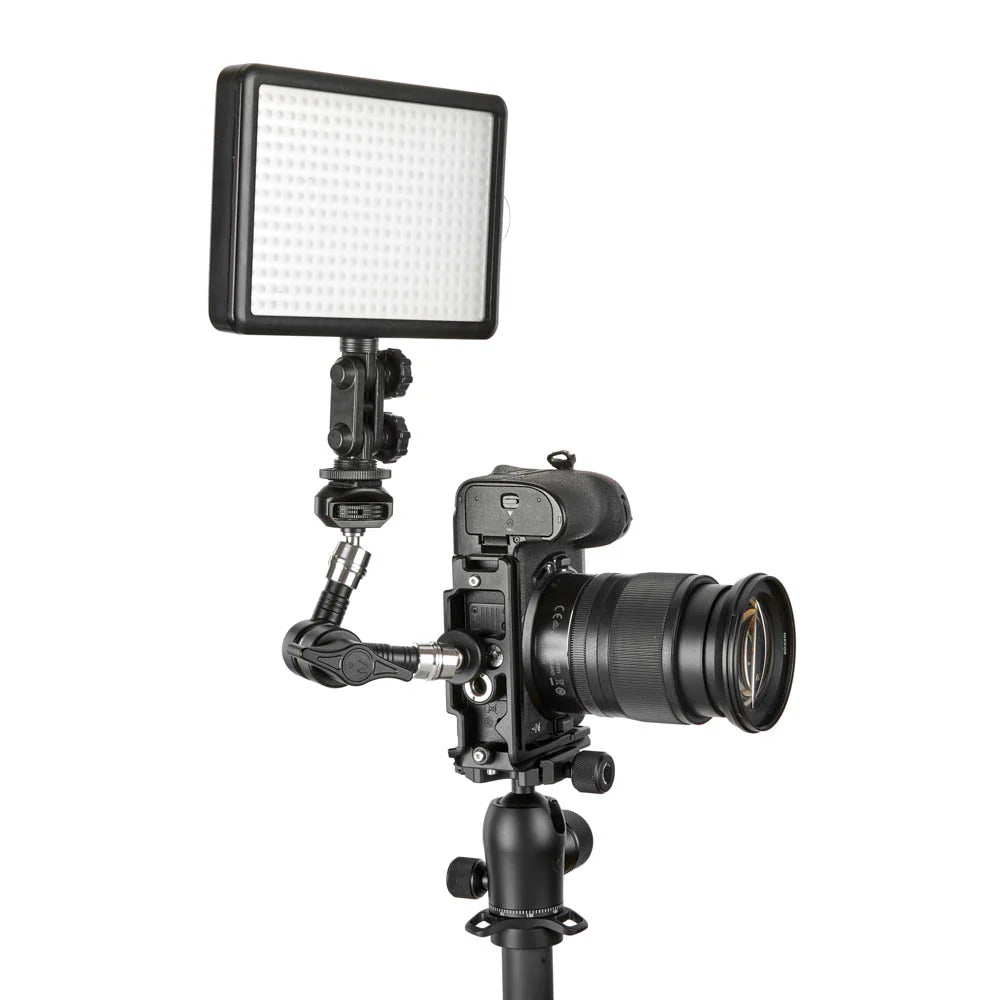 Camera with a light modifier on a white background