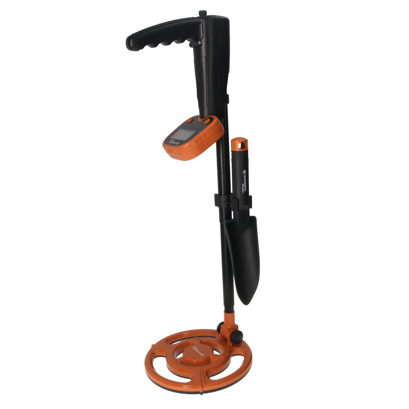 A metal detector set with a black and orange handheld unit, a vertical black probe, a shovel attachment, and an orange circular coil base, shown on a plain white background.