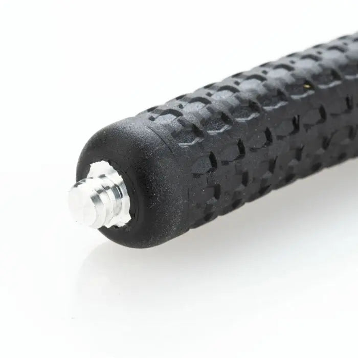 Close-up of a black textured handle on a white background