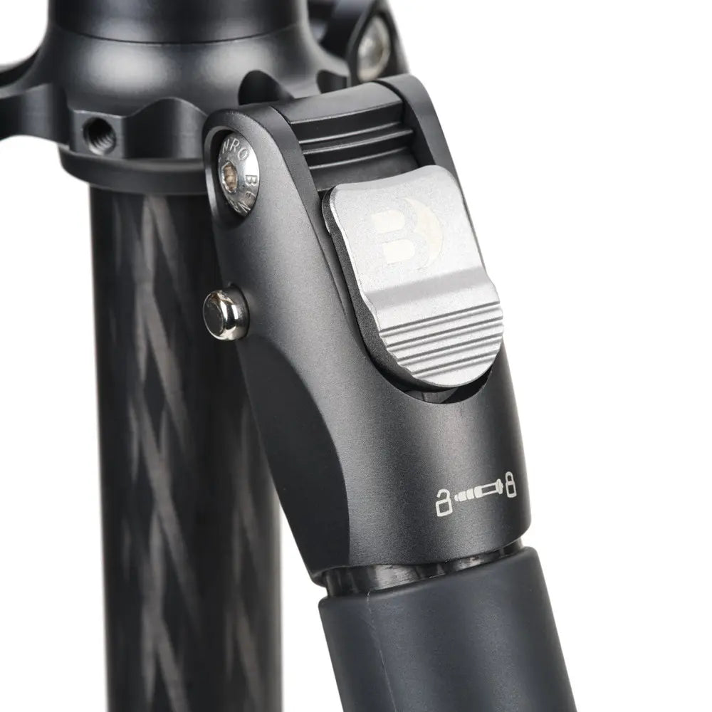 Close-up of a bicycle headlight attached to a black frame with visible brand logo.