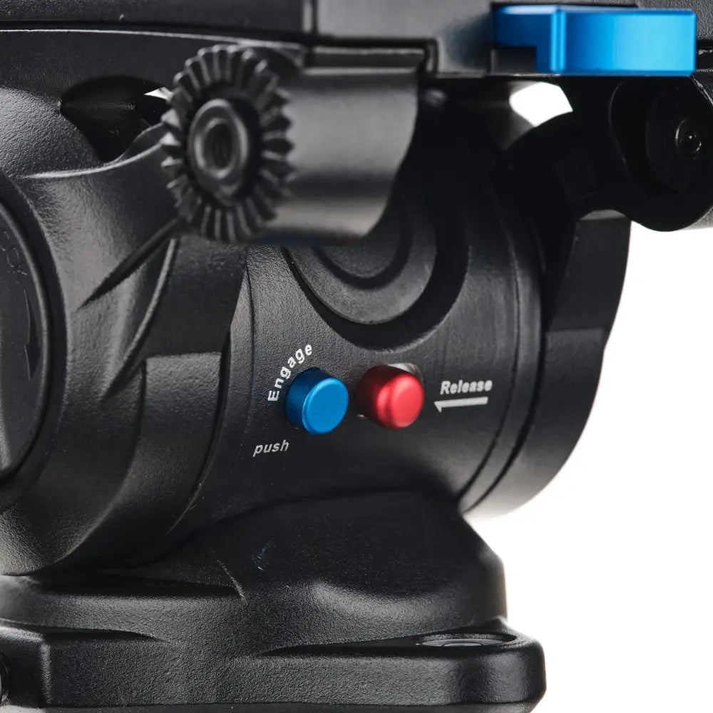 Close-up of a mechanical device with blue and red buttons on a white background
