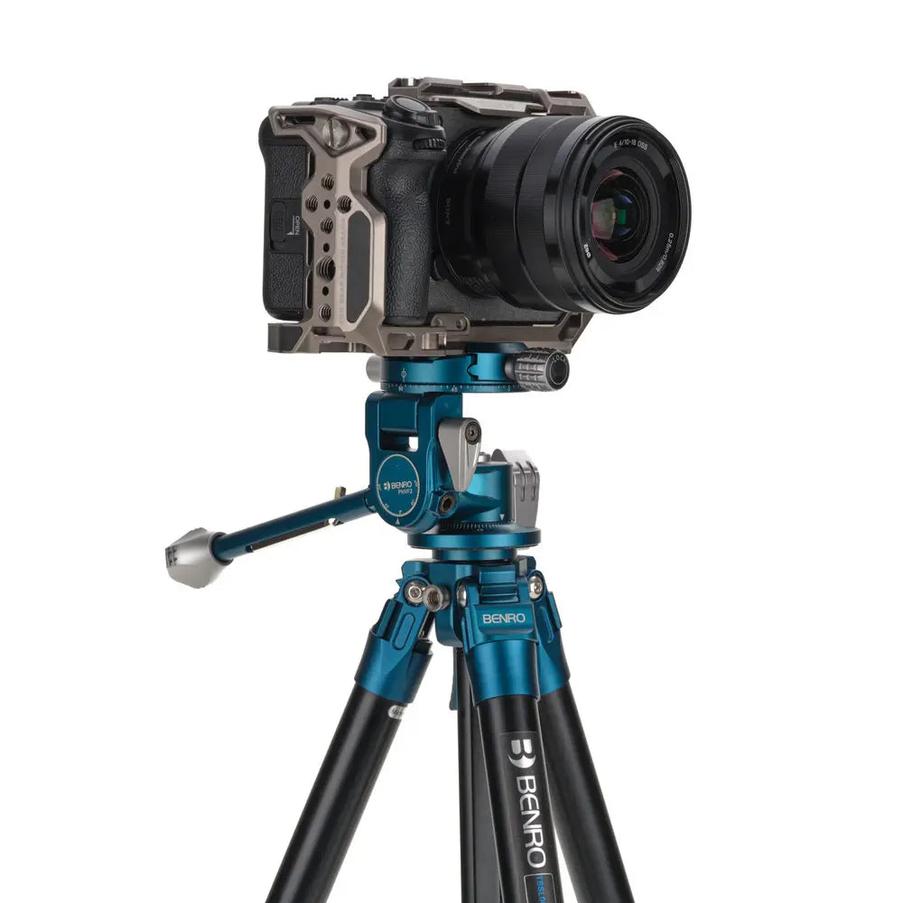 Camera on a Benro tripod with a white background