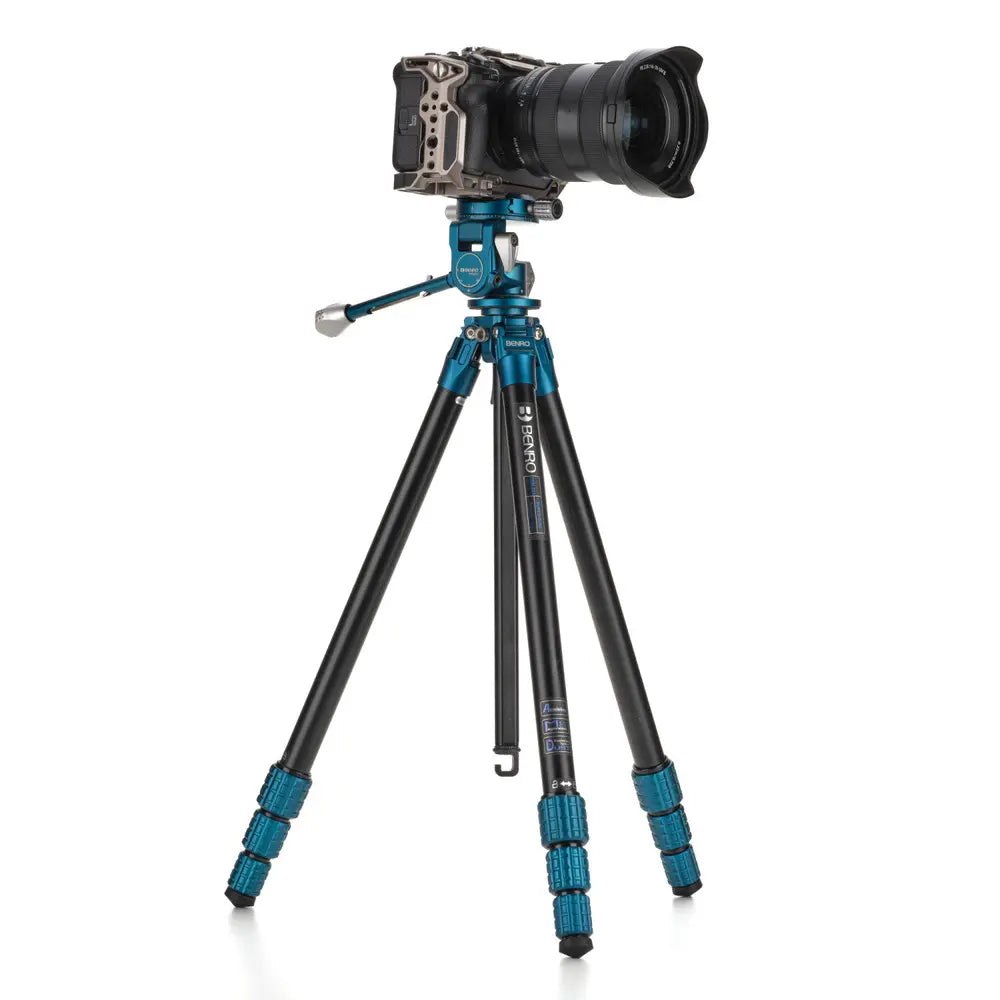 Camera on a tripod with a white background