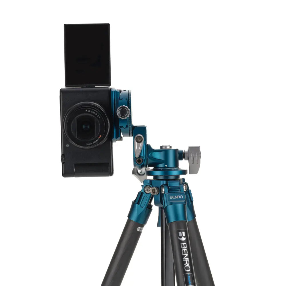 Camera mounted on a Benro tripod with a white background