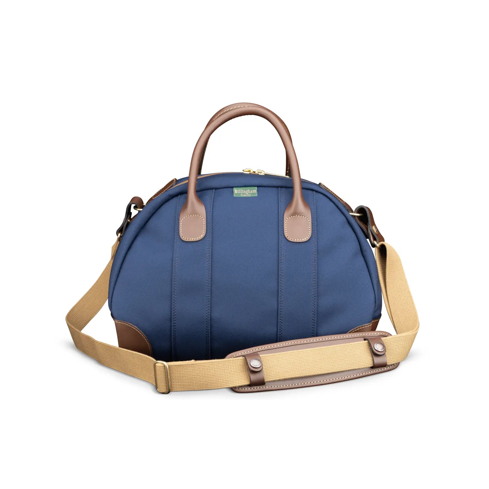 Blue bag with brown handle and strap on a white background