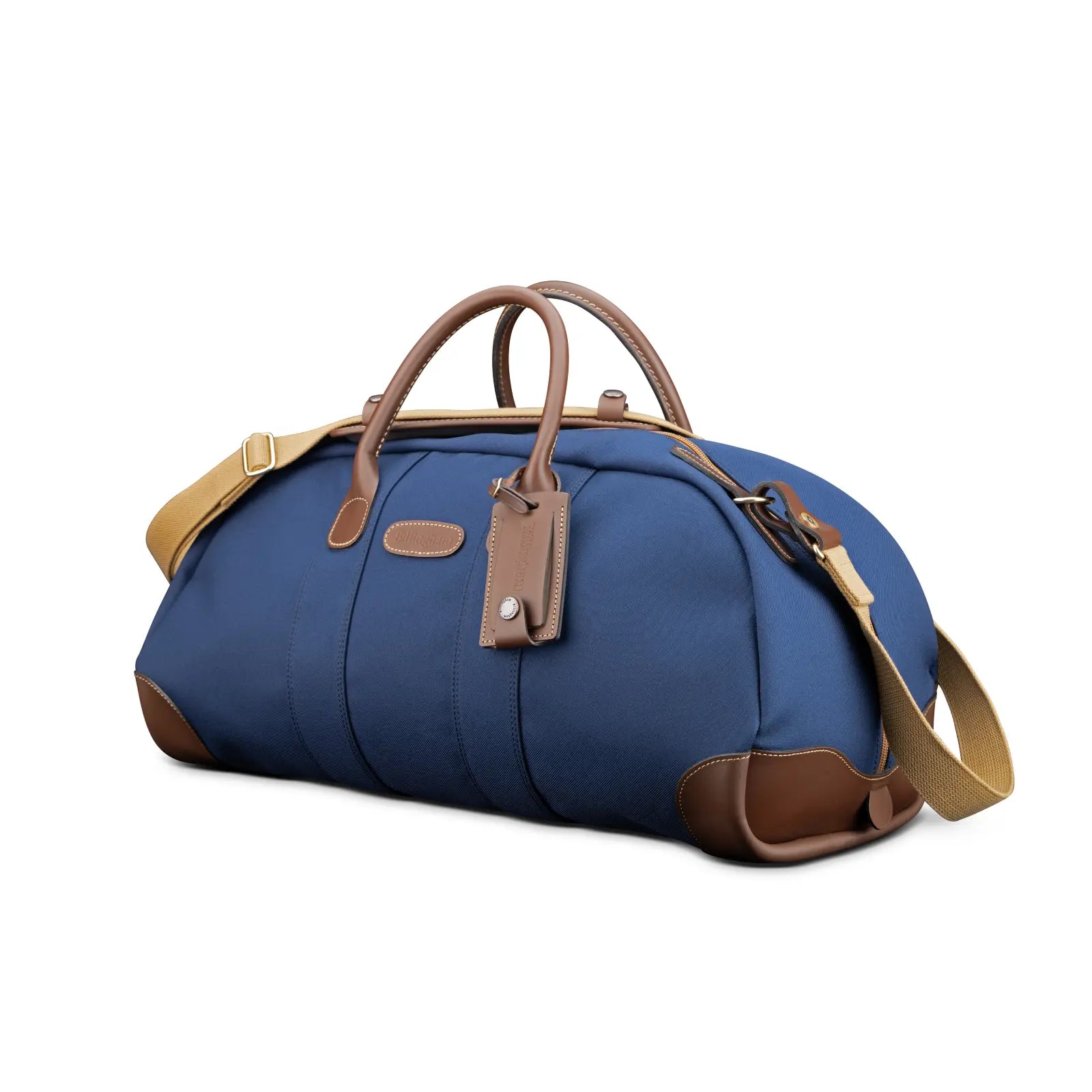 Blue duffel bag with brown leather straps on a white background
