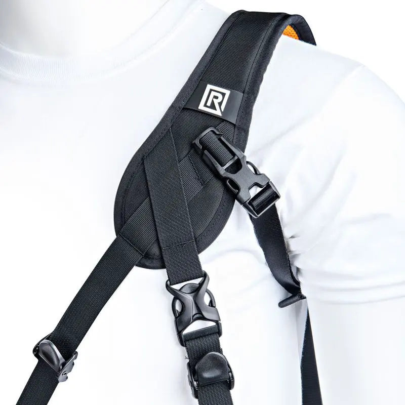 Black shoulder harness with a brand logo on a white background