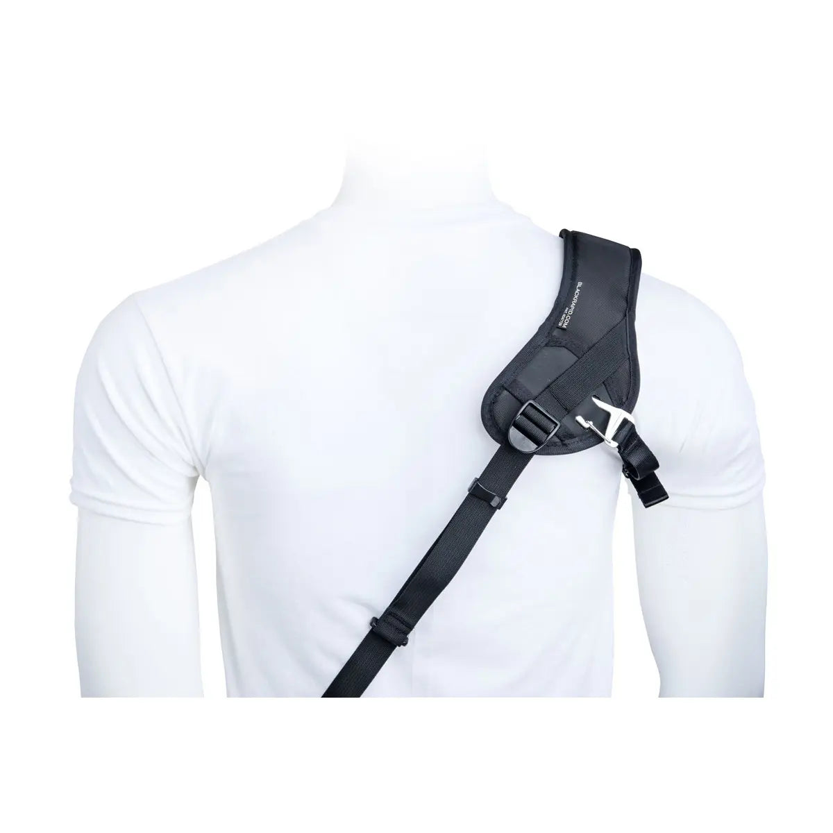 Black shoulder holster on a white shirt