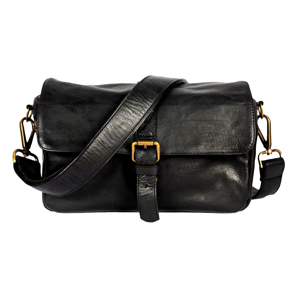 Black leather bag with gold buckles on a white background