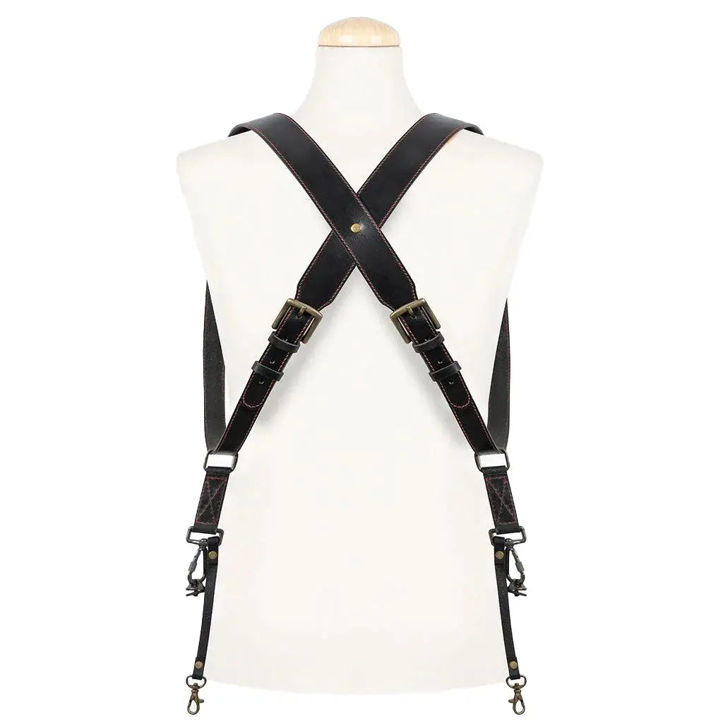 Black leather harness on a mannequin against a white background