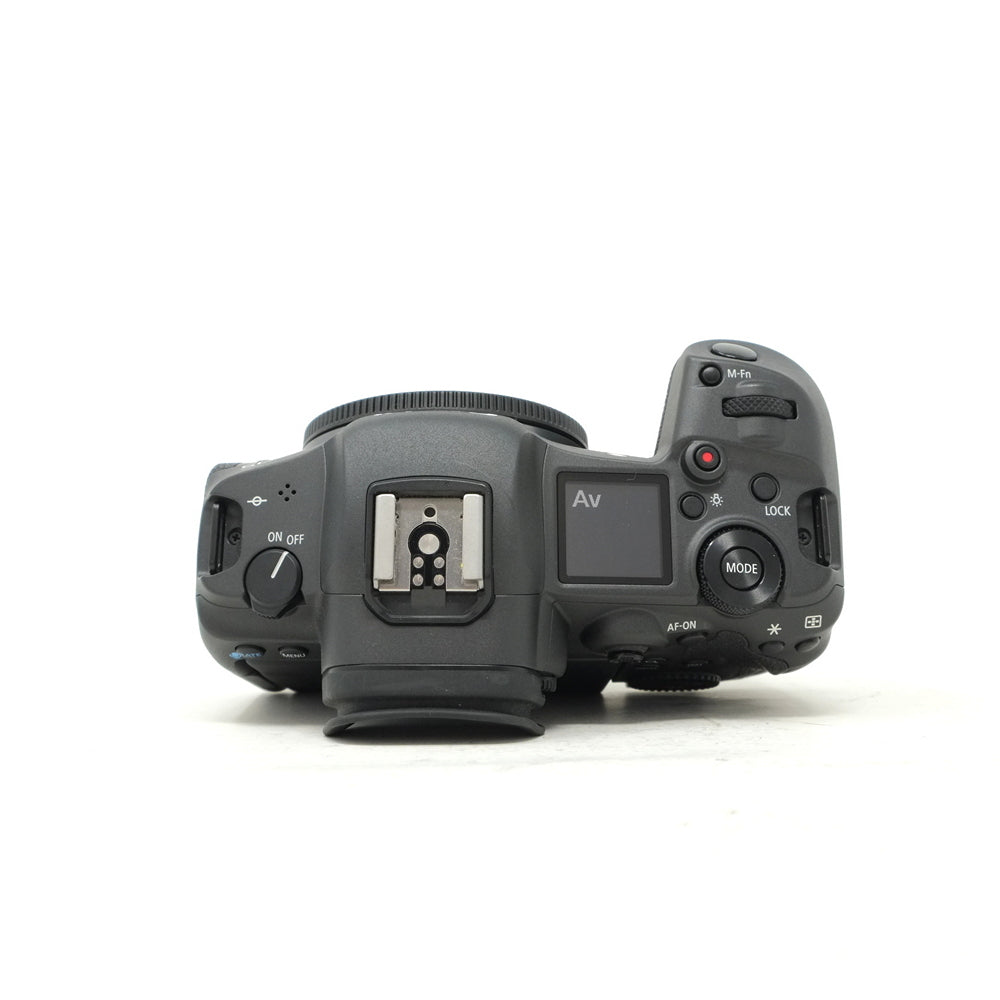 Camera body with control dials and buttons on a white background