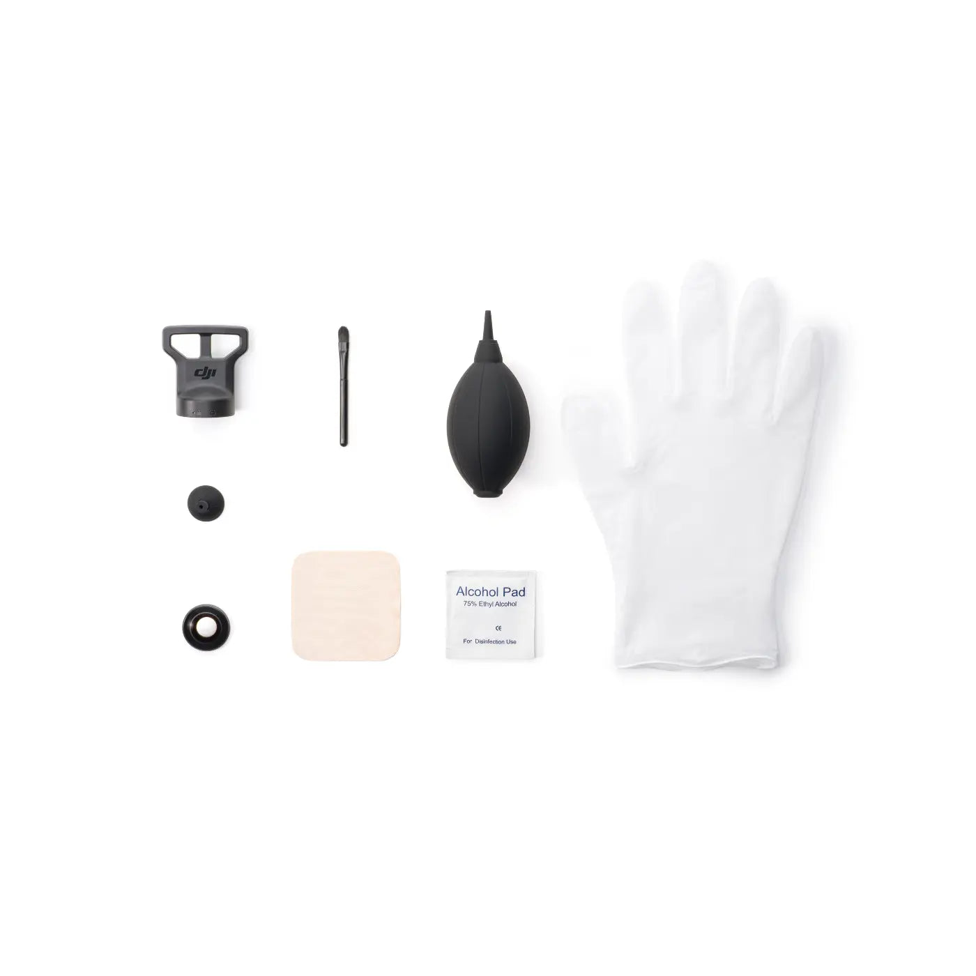 White cloth, alcohol pad, and cotton swabs on a white background