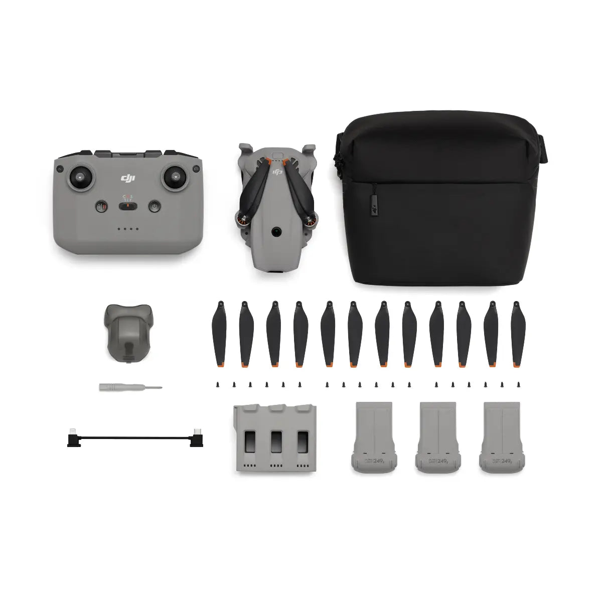 DJI Mavic Mini drone components including controller, drone body, battery, propellers, and carrying case on a white background.