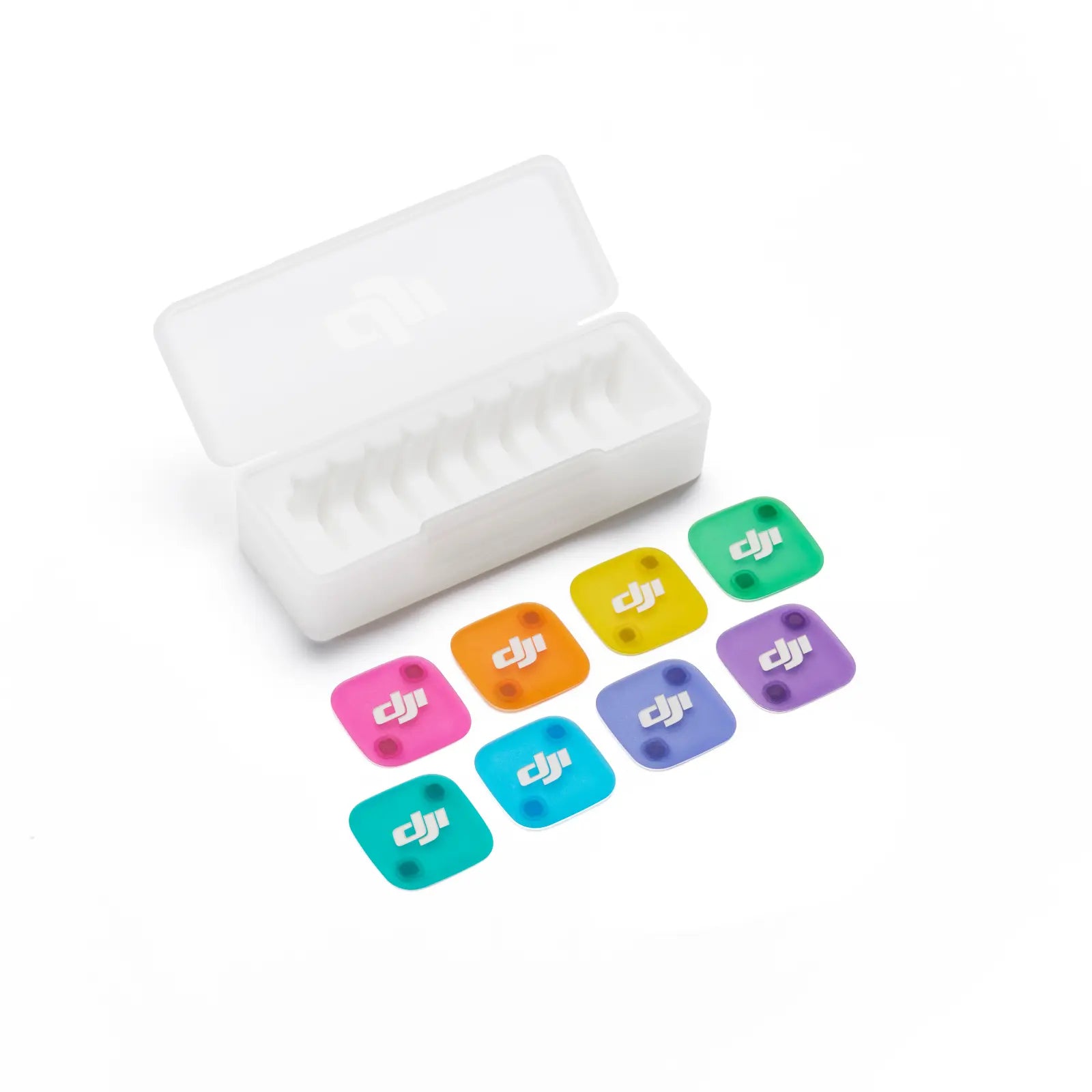 Set of colorful stickers with DJI logo next to a white rectangular object on a white background