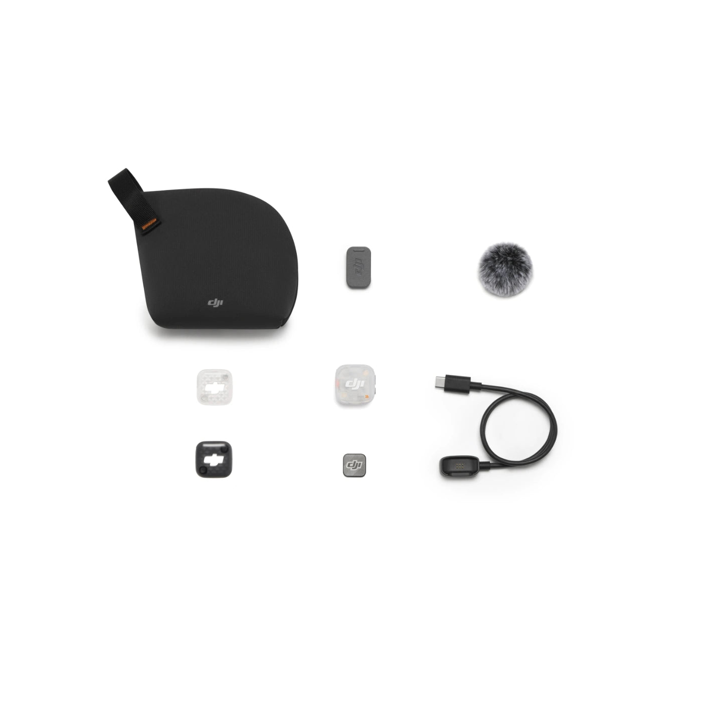 DJI external microphone kit with a black foam windscreen, USB-C cable, and various mounting accessories arranged on a clean white background.