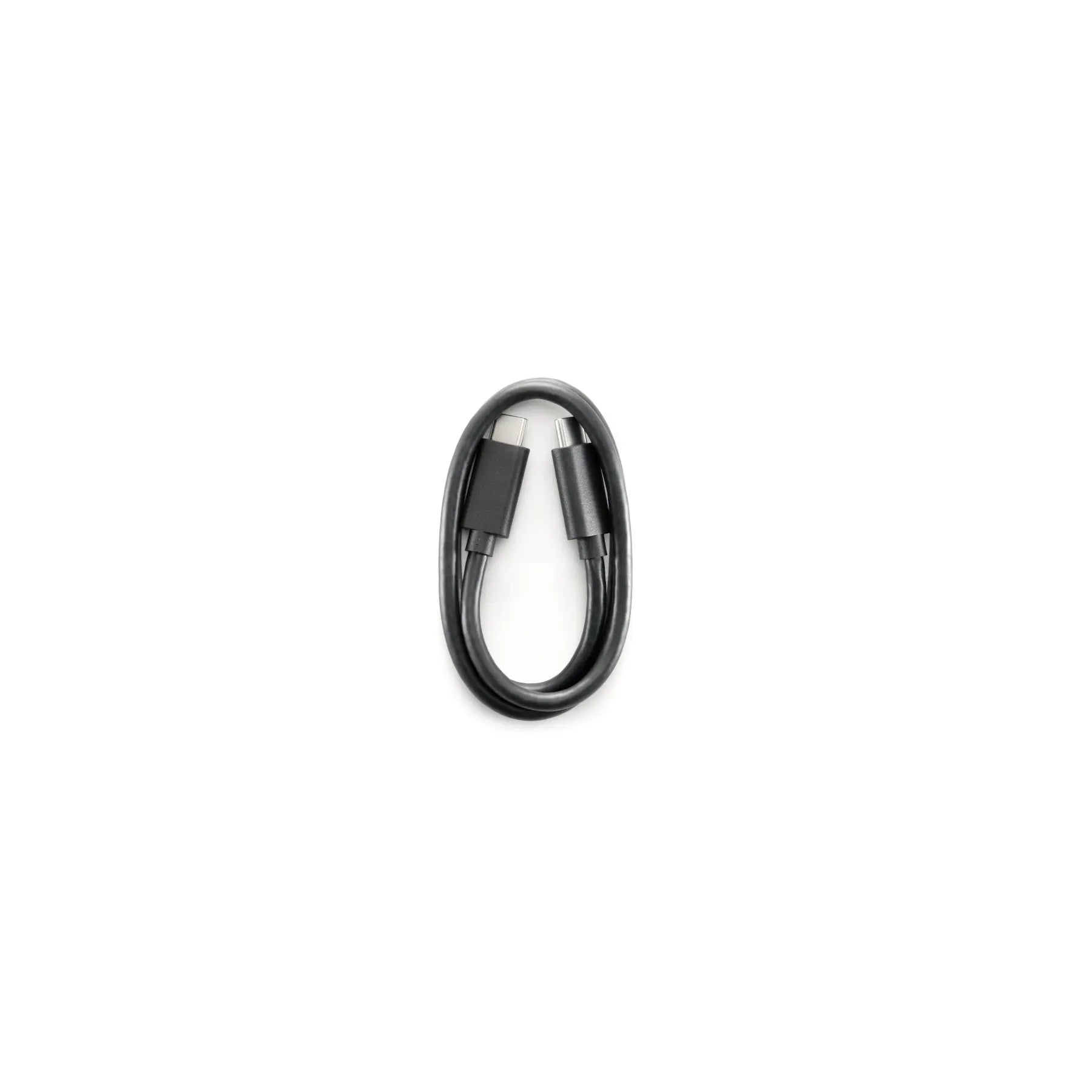 Black USB cable coiled on a white background