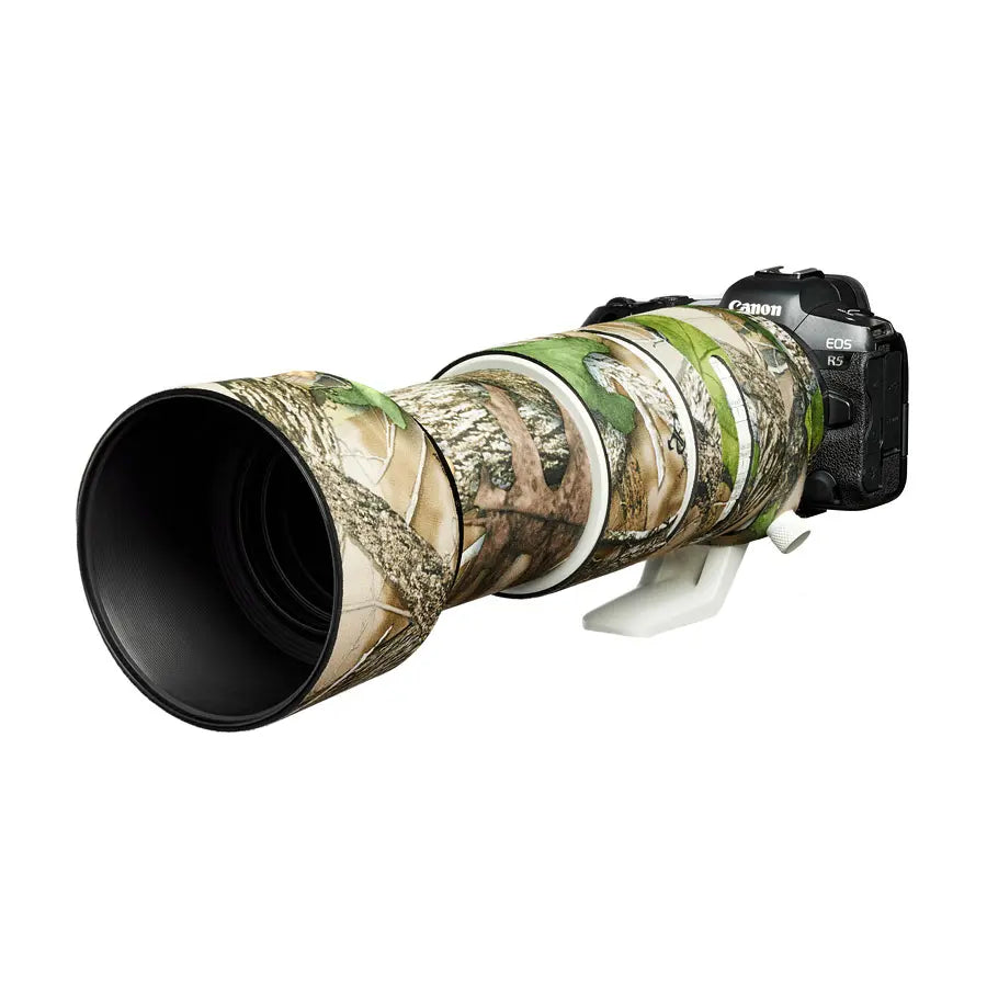 Canon camera with a camouflaged lens on a white background