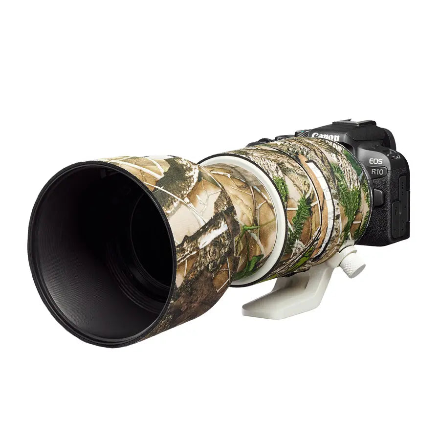 Camera with a camouflaged lens on a white background