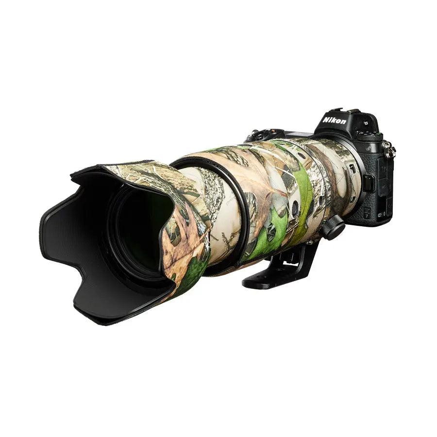Camouflage-covered camera lens with Nikon branding on a white background