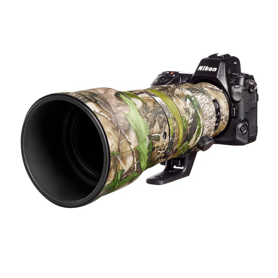 Nikon camera with a camouflaged lens on a white background