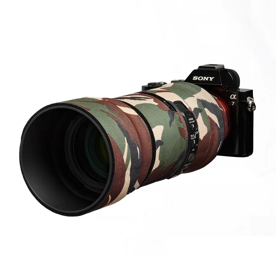 Camouflage-covered Sony camera lens on a white background