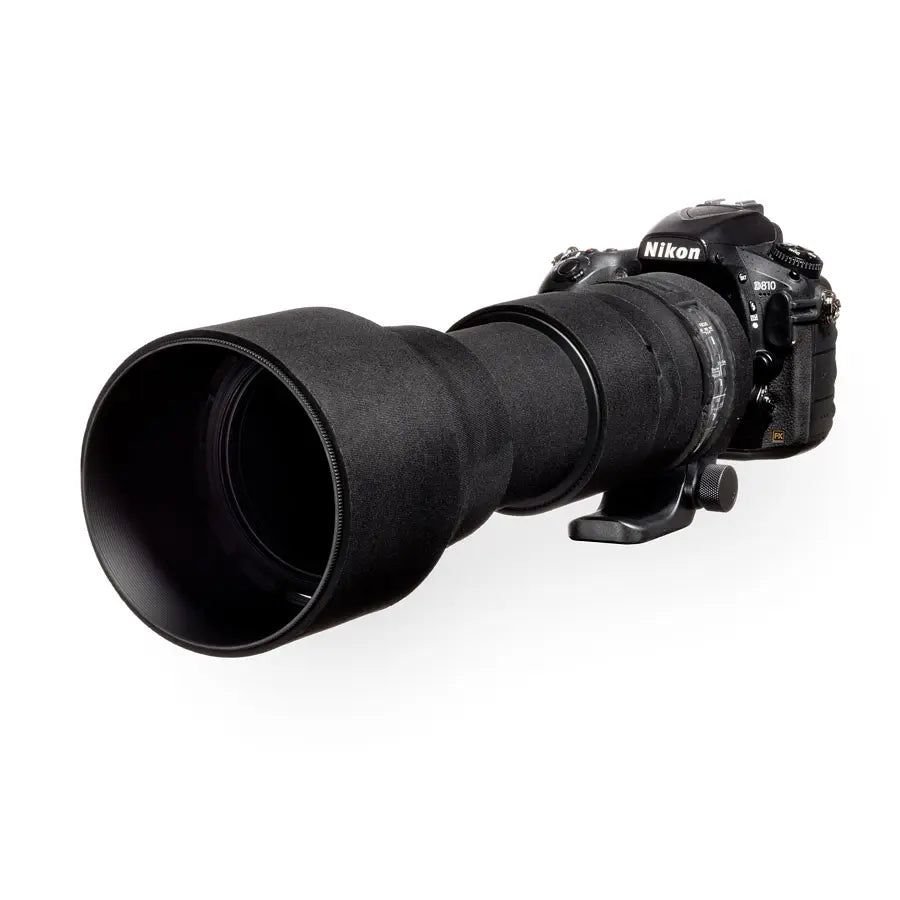 Nikon camera with a large lens on a white background