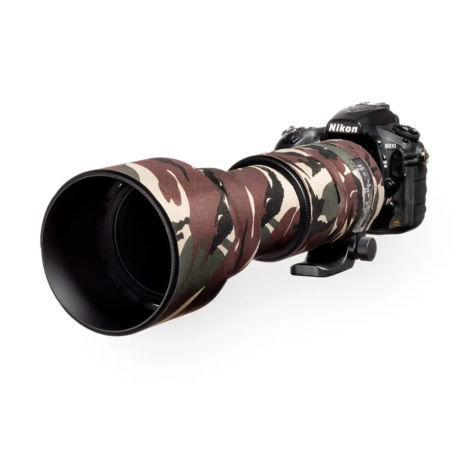 Nikon camera with a camouflaged lens on a white background