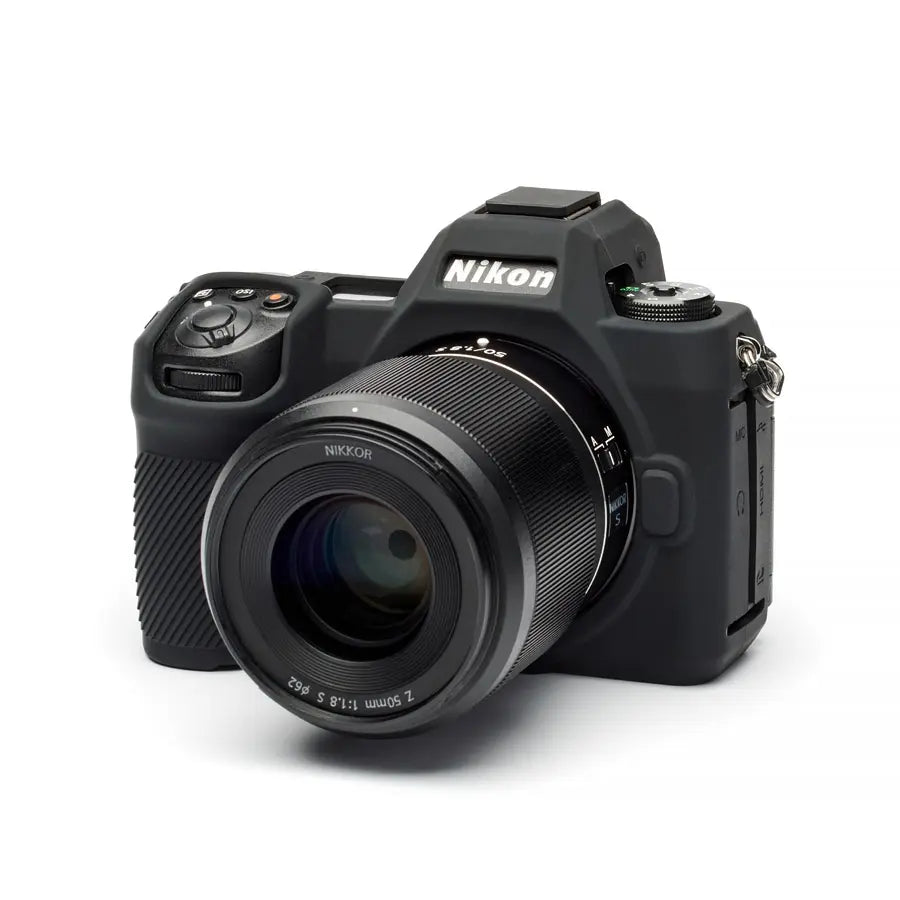 Black Nikon camera on a white background