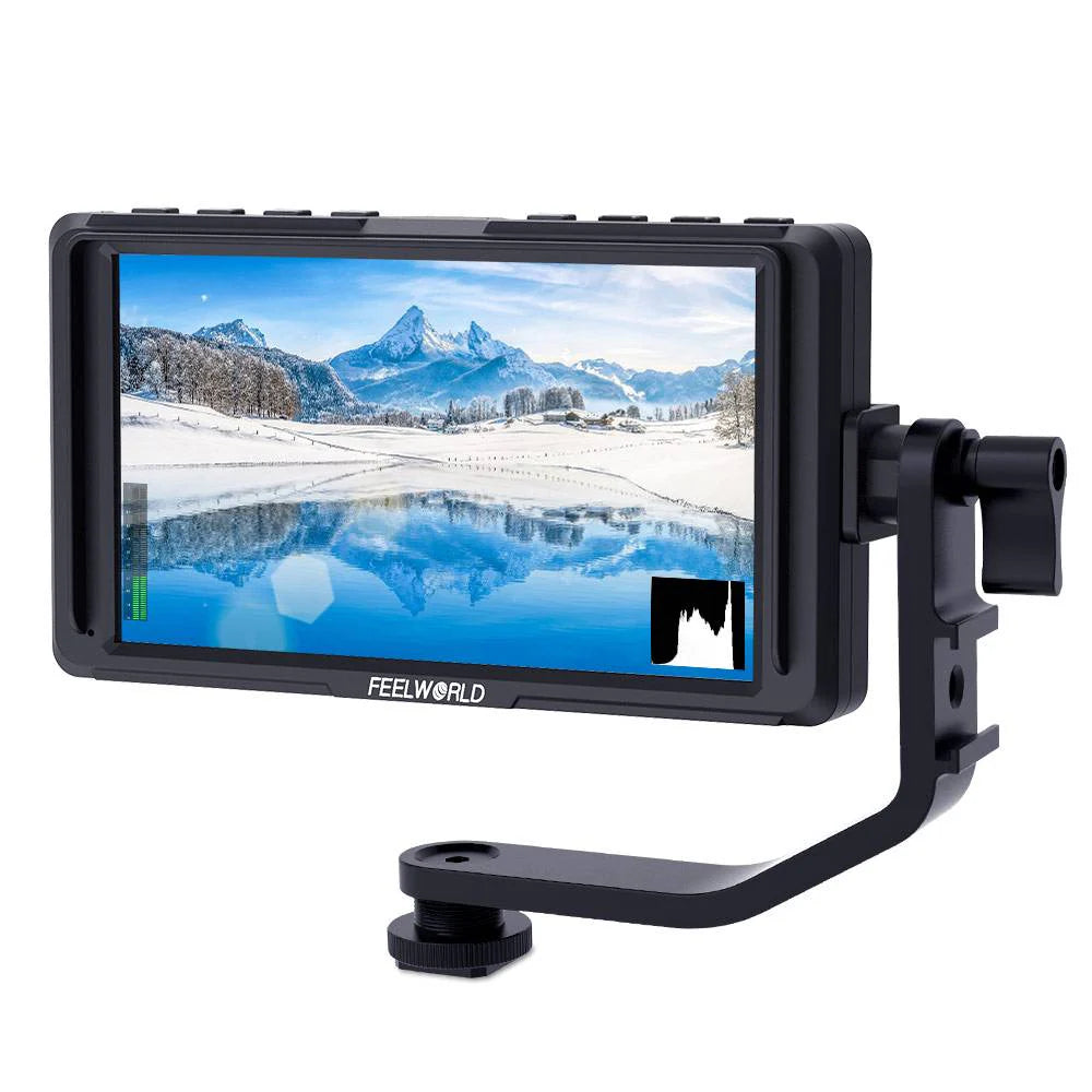 Camera monitor displaying a snowy mountain landscape with 'Feelworld' branding