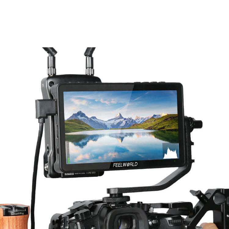 Camera monitor displaying a mountainous landscape with 'FeelWorld' branding.