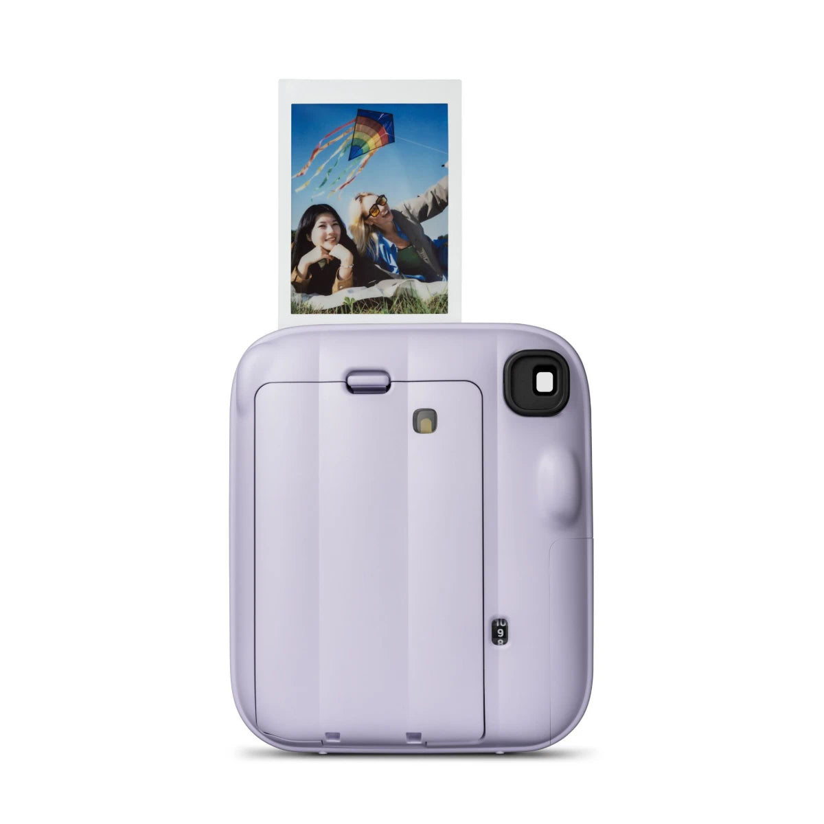 Purple instant camera with a printed photo of a couple and kite on a white background