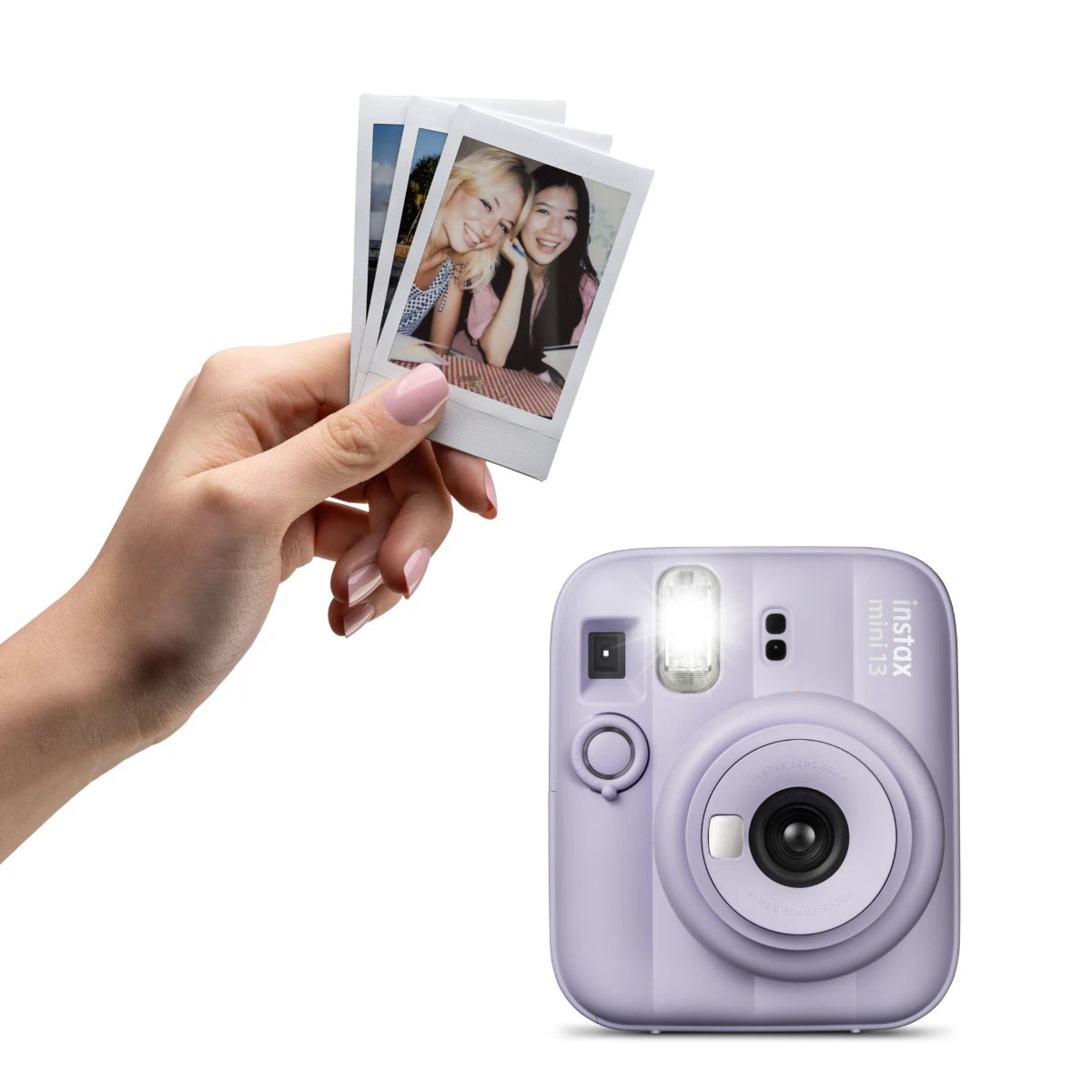 Lilac instant camera with a hand holding three photos on a white background
