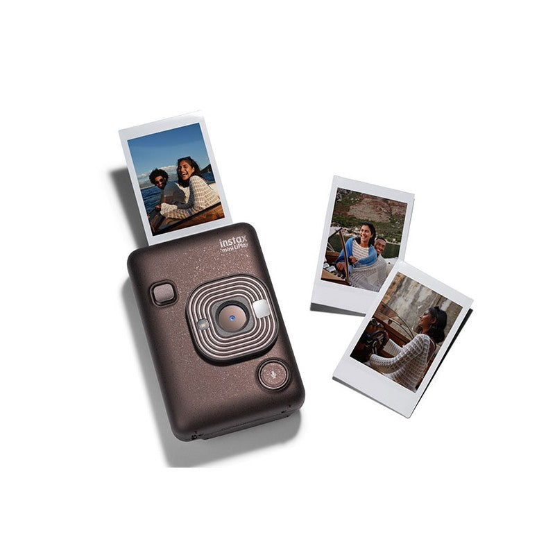 Instant camera with instant prints on a white background