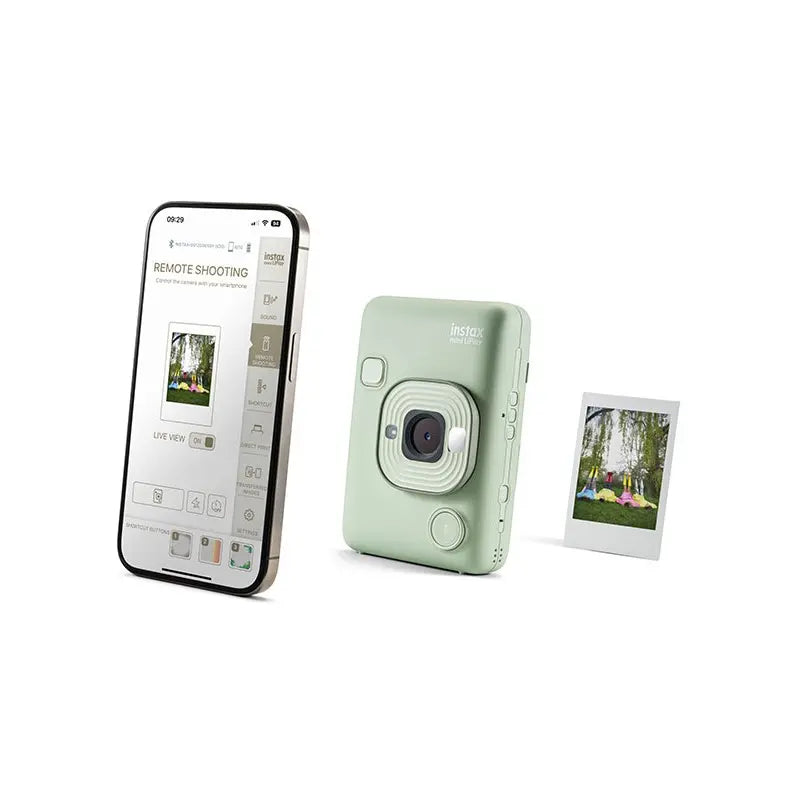 Mint green instant camera with smartphone displaying app interface on a white background