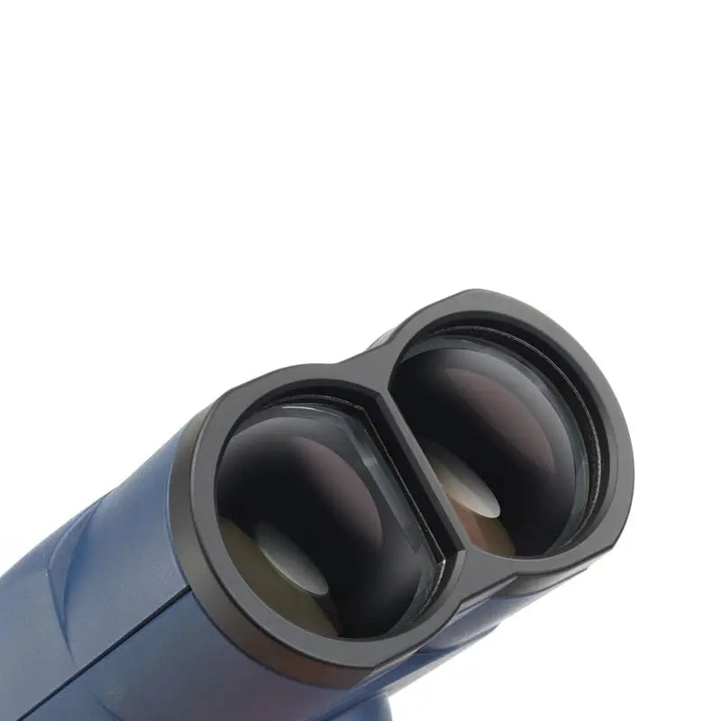 Close-up of a blue and black object with two circular openings on a white background