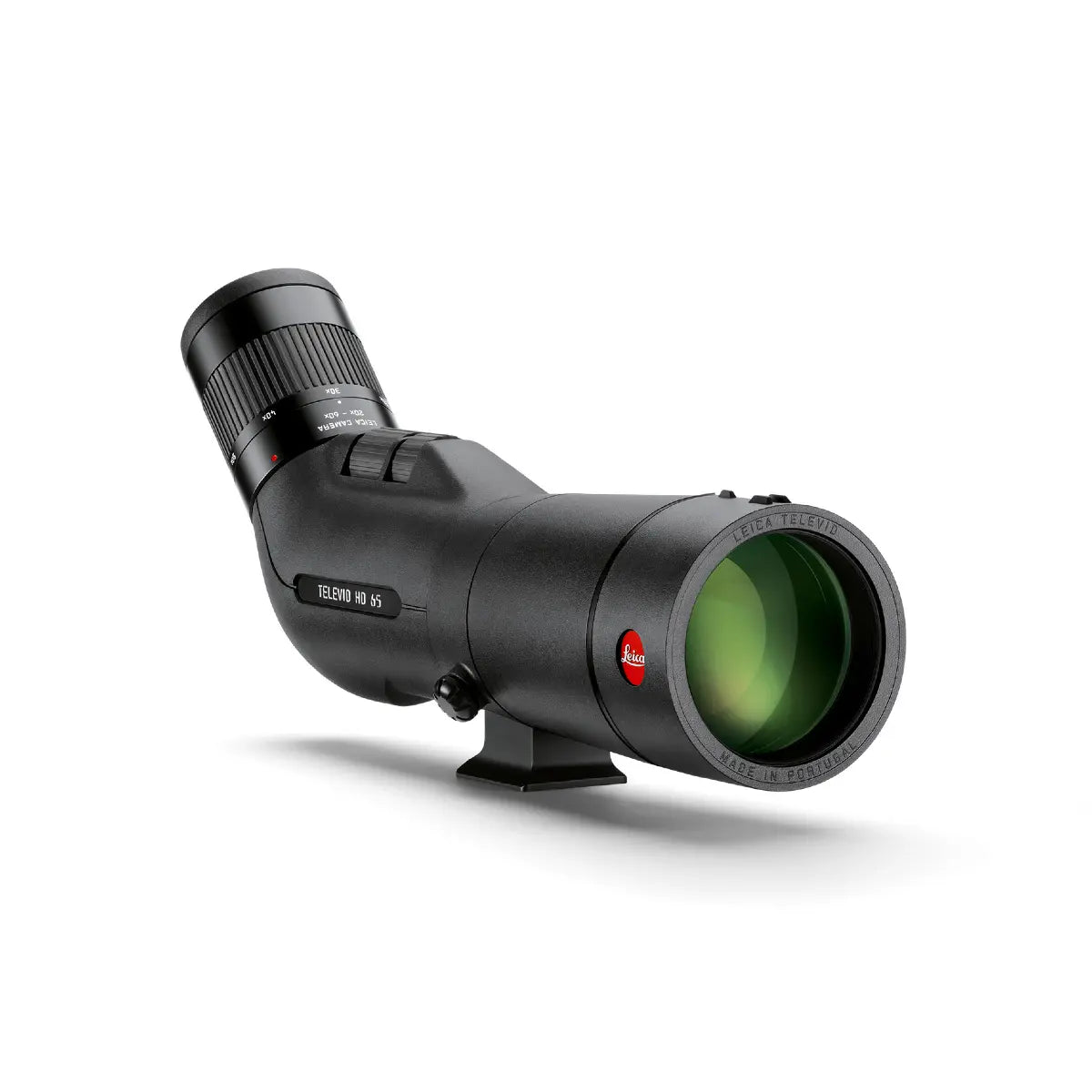 Black spotting scope with green lens on a white background
