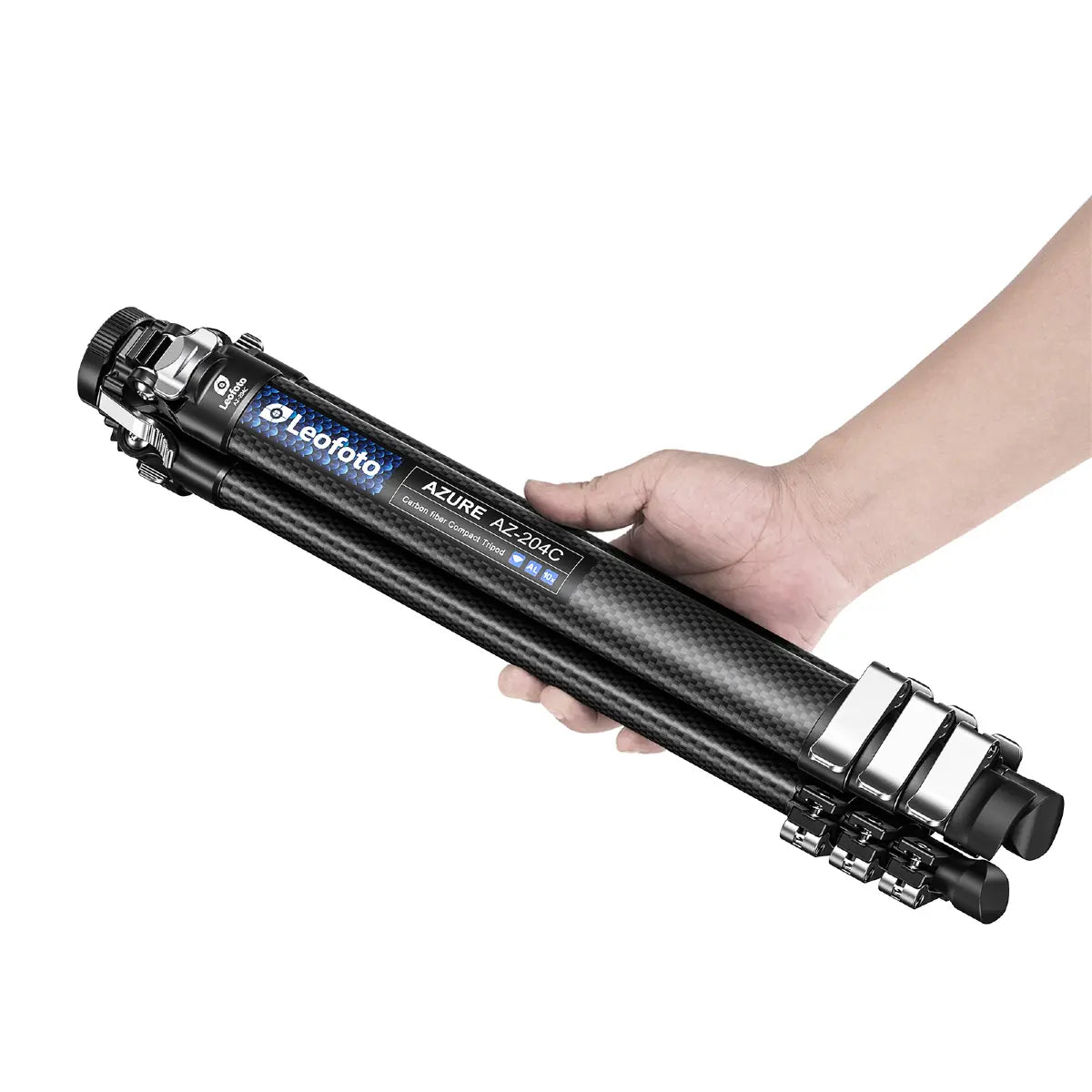 Hand holding a Leofoto camera tripod on a white background