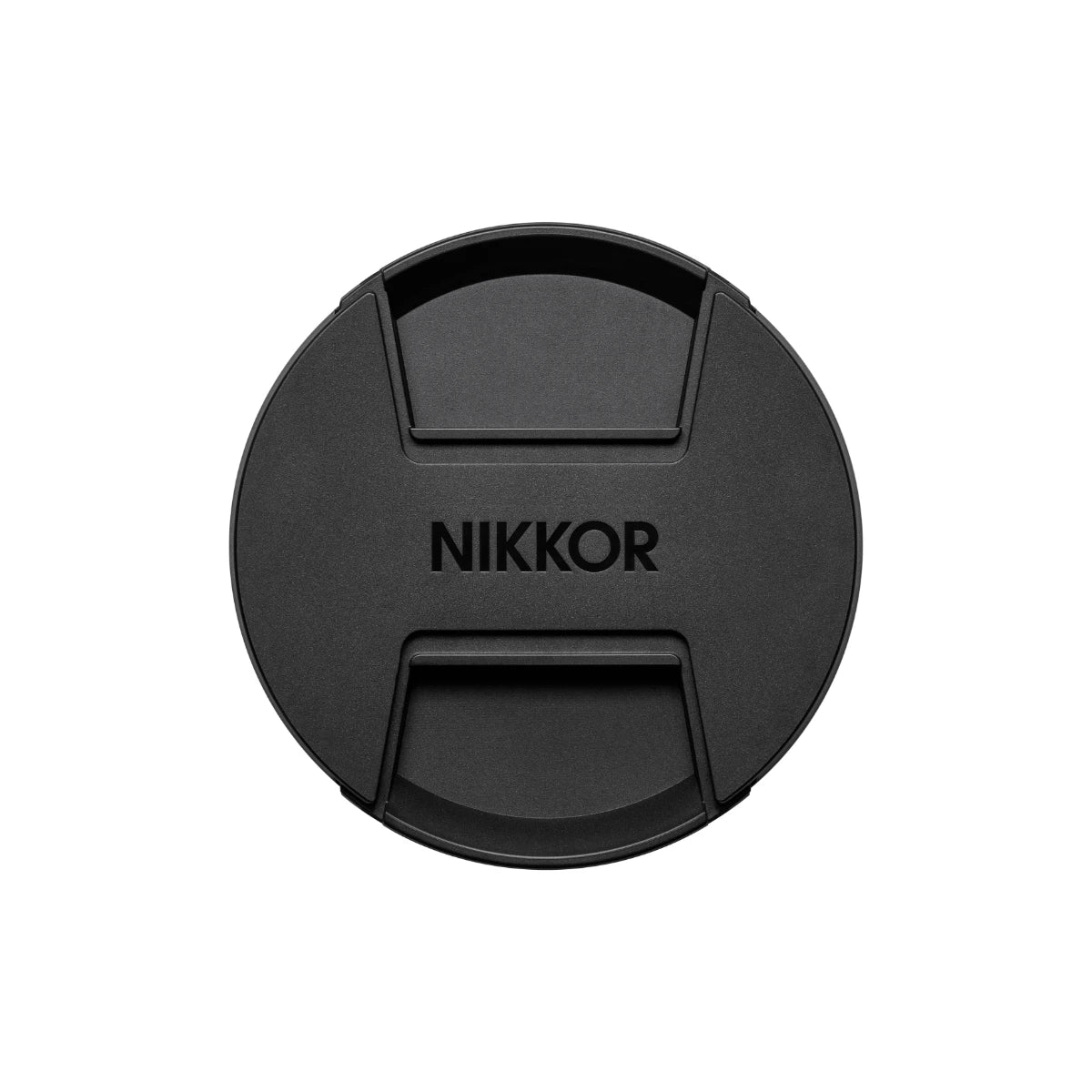 A black circular lens cap with the brand name 'NIKKOR' printed in the center, shown against a plain white background.